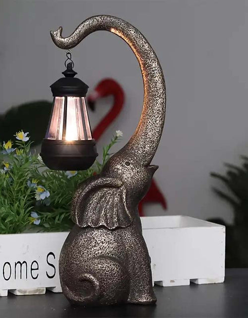 Load image into Gallery viewer, Solar Powered Elephant Statue - Color-Changing LED Garden Decor
